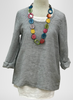 Pure Top (shown in Stormy Stripe) with sleeves rolled up, worn over the Layer Tank (in White).  Accessorized with a colorful Tagua Necklace (sold in-store only).