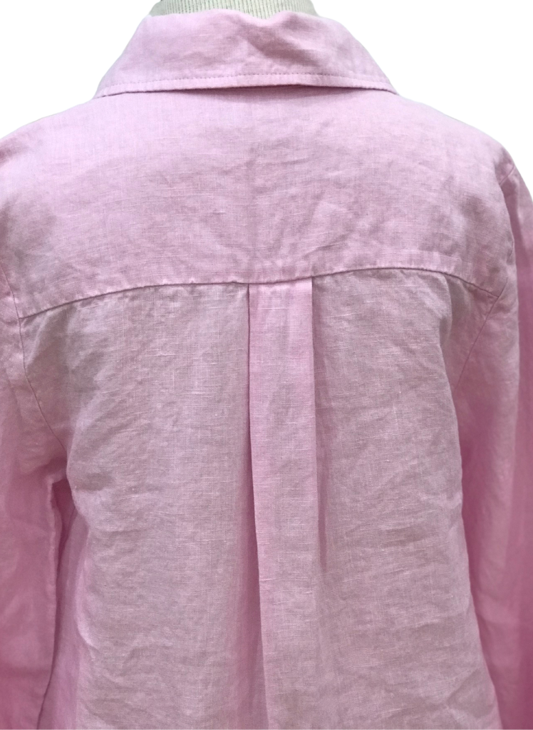 Afternoon Cover, shown in Carnation (pink), features back yoke and pleat detail.