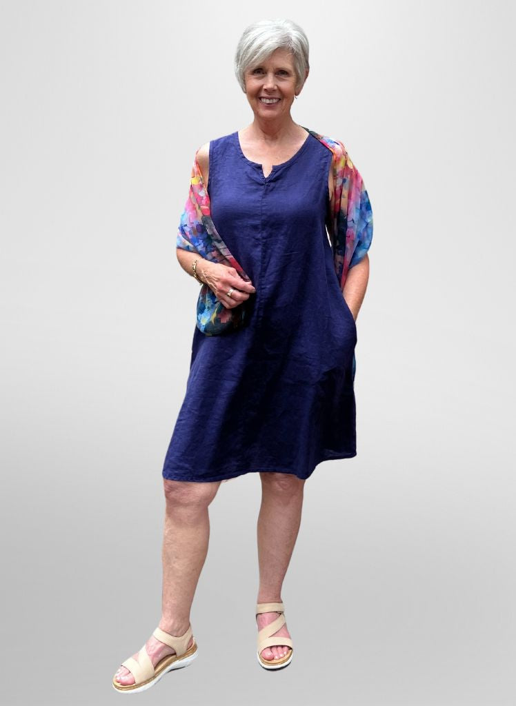 True Dress, shown in Indigo size Small. (Accessories are sold in-store only). Model is 5’9” tall.