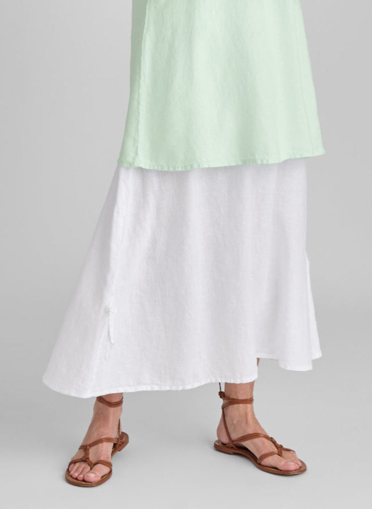 Cinch Skirt, shown in White, size Small. Features a wide cotton knit with a limited Cinch and tie detail on either side, for adjustability and style.