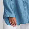 Dramatic Shirt (shown in Caribbean), zoomed to feature the long flowing sleeves with hem finish, along with the rounded shirttail hem finished with side slits, for added comfort and movement, slightly longer in the back for ample backside coverage.