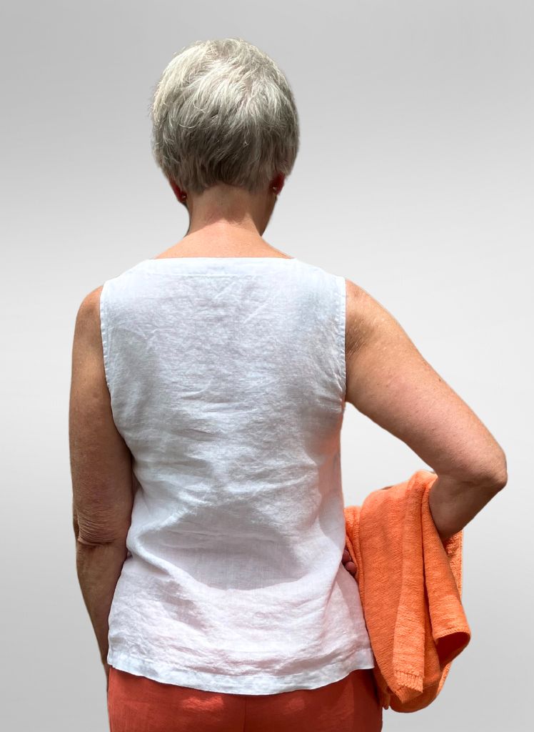 Gem Tank, shown in White (on the reverse), size Small.  100% European Linen.  Paired here with the Flat Iron Pant in Mango, and the Cotton Crew Neck Sweater in Mandarin.