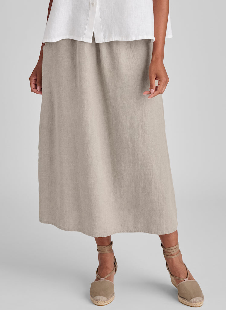 Go-To Skirt, shown in Natural, size Small. Model is 5'9" tall, so if you are shorter, then the hemline will be longer on you, landing closer to your ankle.