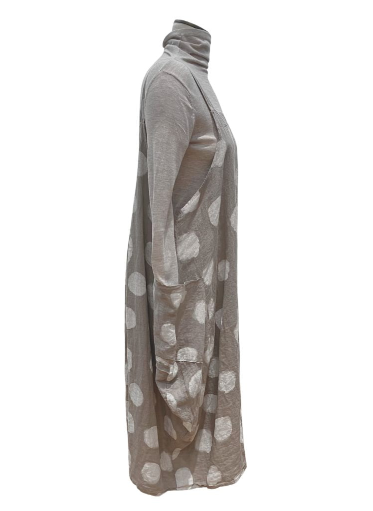 Sleeveless Dot Dress, shown in Taupe (layered over a neutral turtleneck), on the side, to show the arm hole and large side pocket detailing.