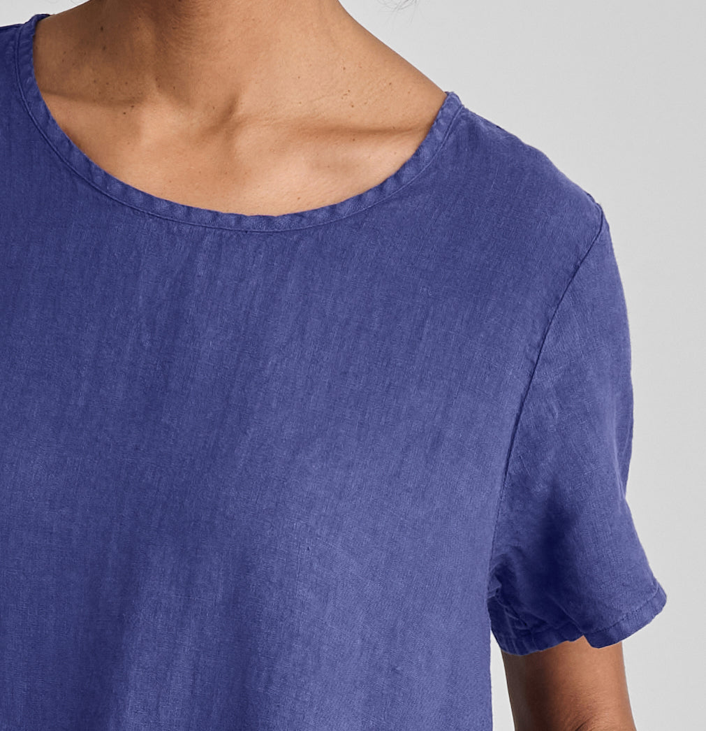 Ruthie's Dress, shown in Blueberry. Featuring a close-up of the rounded neckline and short sleeve detail.