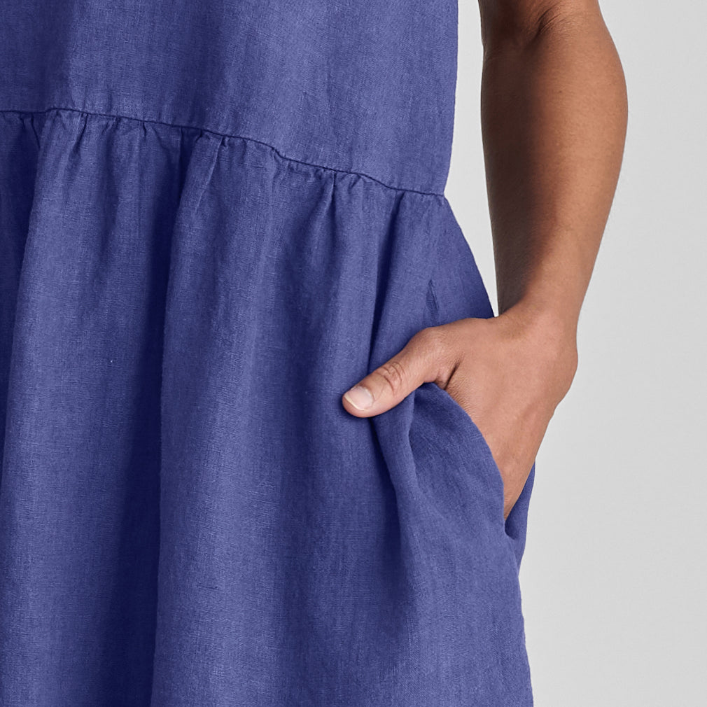 Ruthie's Dress, shown in Blueberry. Featuring a close-up of the gathered detail along the waist, and side seam pocket.