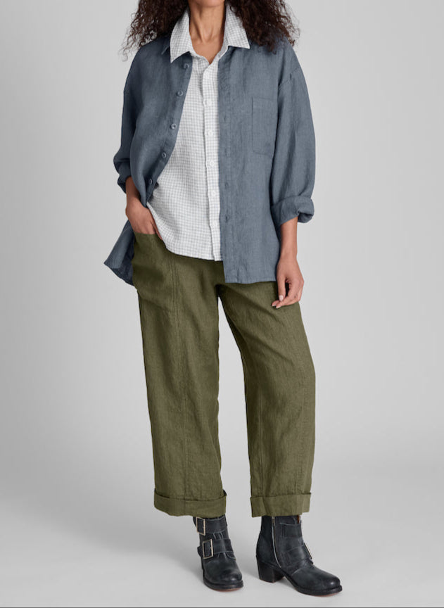 Whole Shirt, shown in Slate, size Small. Worn open, as a light jacket, with the sleeves rolled up. Layered over the Cherished Shirt (color n/a) and the Keen Pant (in Herb). Model is 5'9" tall.  Unisex style, 100% Medium-weight European Linen