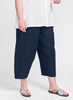 Seamly Pant (shown in solid Midnight (Navy), ankle length linen pant with a full elastic waist, side pockets, and roomy legs othat taper along the gathered cuff.