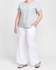 Tee Top (Mist) + Flat Iron Pant (White), Model is 5'9" tall, wearing size Medium.