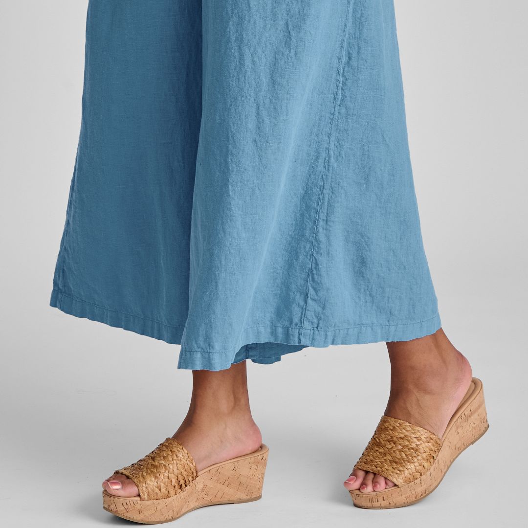 Urban Jumpsuit, shown in Caribbean.  Zoom on wide pant legs.  Model is 5’9” tall.  If you are shorter, then the length with fall a little bit further down toward your ankle.