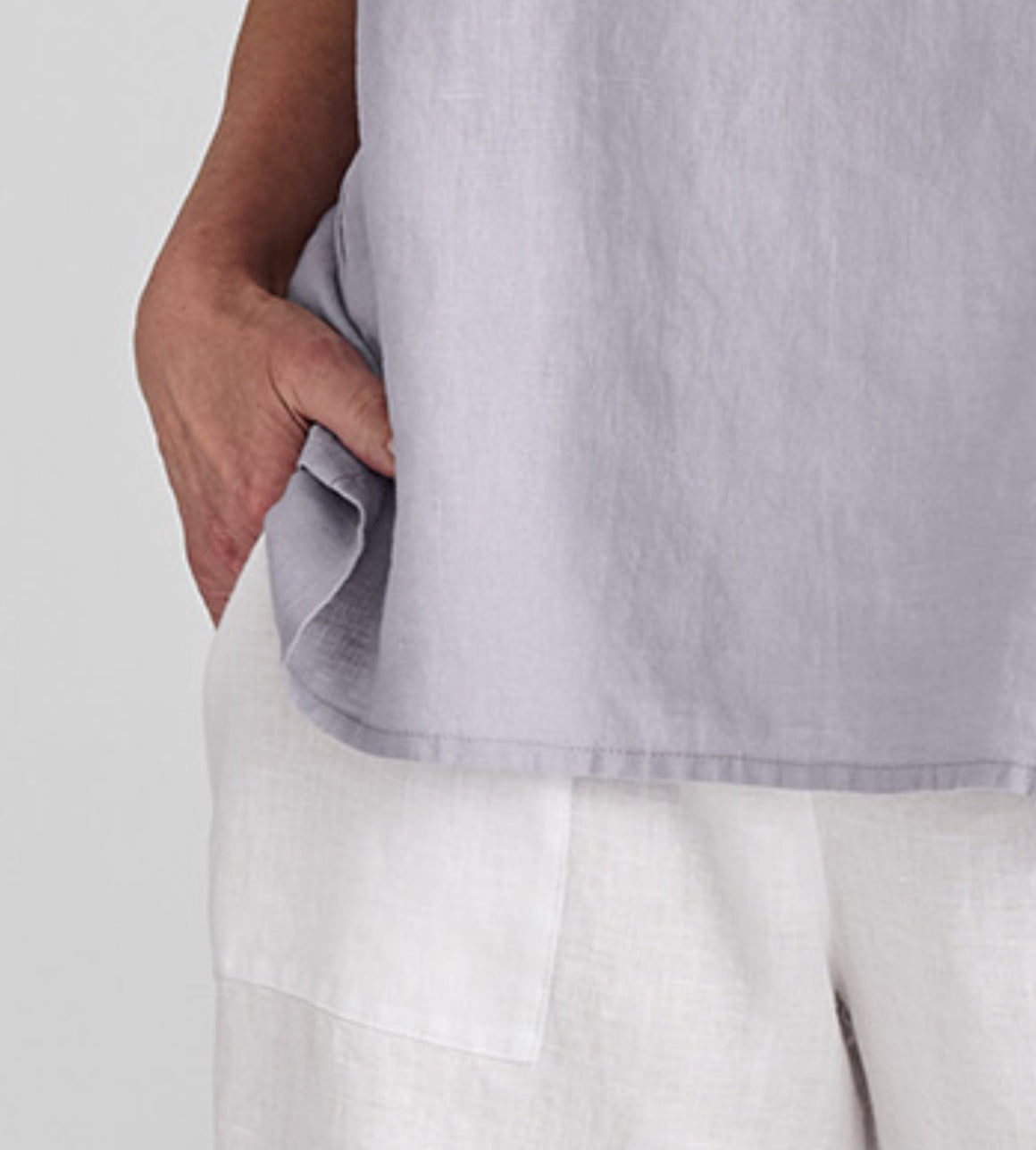 Kate Pant, shown in White.  Zoomed in on the large side patch pocket detail.