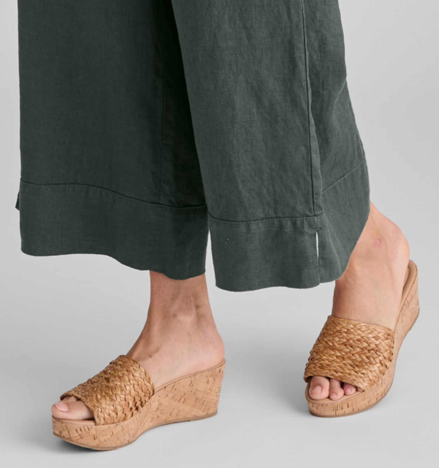 Vented Cuff Pant, shown in Petrol.  Zoomed in on the wide border and hem slit detail.
