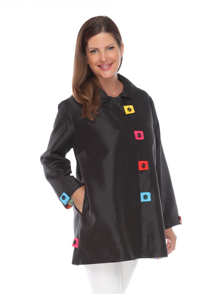 Oopera Rain Coat, shown in Black.  Worn buttoned, hood is detached showing the shirt collar, and sleeves are worn at full length.