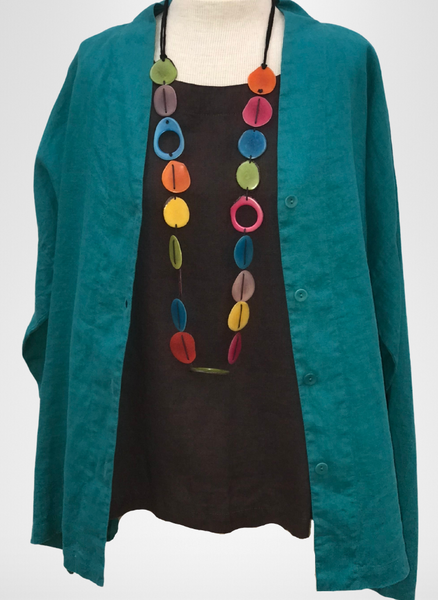Alluring Blouse (shown in Mediterranean) layered over the Starling Top (in Chocolate) topped with a colorful Tagua Necklace (sold in-store only).