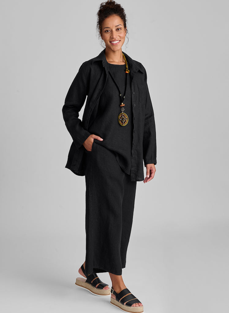 Bias Back Shirt, worn open and layered over the sleeveless Side Pocket Tunic, paired with the Sociable Floods to match (shown in Black). Model is 5'9" tall, wearing size Small