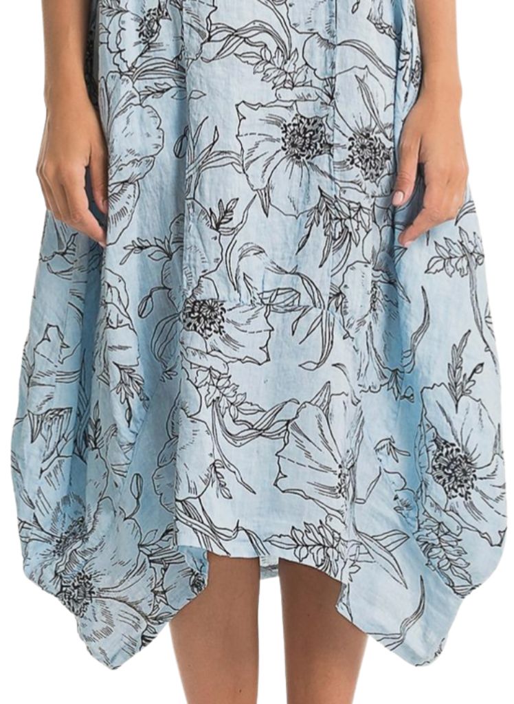Featuring wide curved hemline, longer on the sides, and shorter in the center.  Lands between Mid-length and Maxi, depending on your height.  Model shown is 5'9" tall.