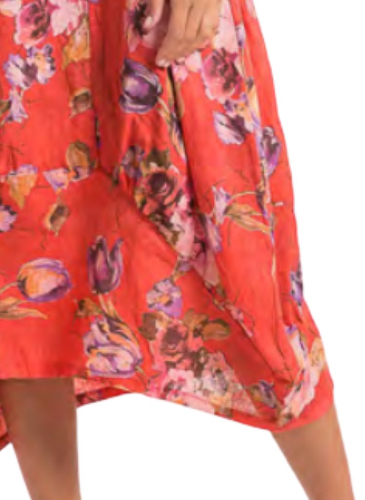 Featuring wide curved hemline, longer on the sides, and shorter in the center.  Lands between Mid-length and Maxi, depending on your height.  Model shown is 5'9" tall.
