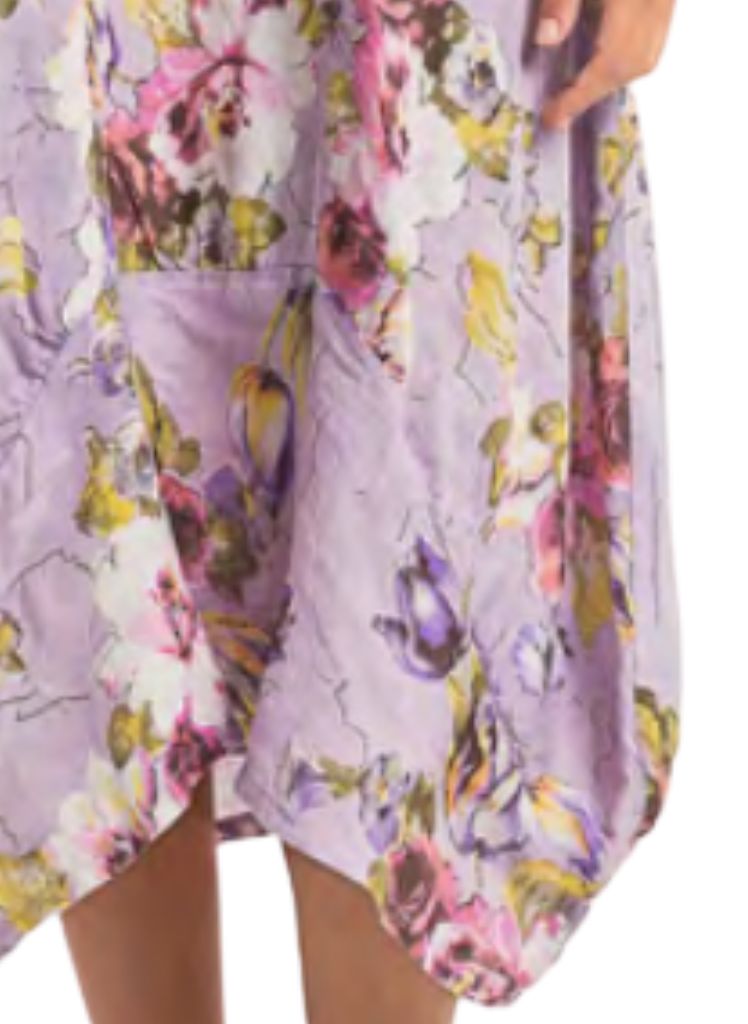Featuring wide curved hemline, longer on the sides, and shorter in the center.  Lands between Mid-length and Maxi, depending on your height.  Model shown is 5'9" tall.