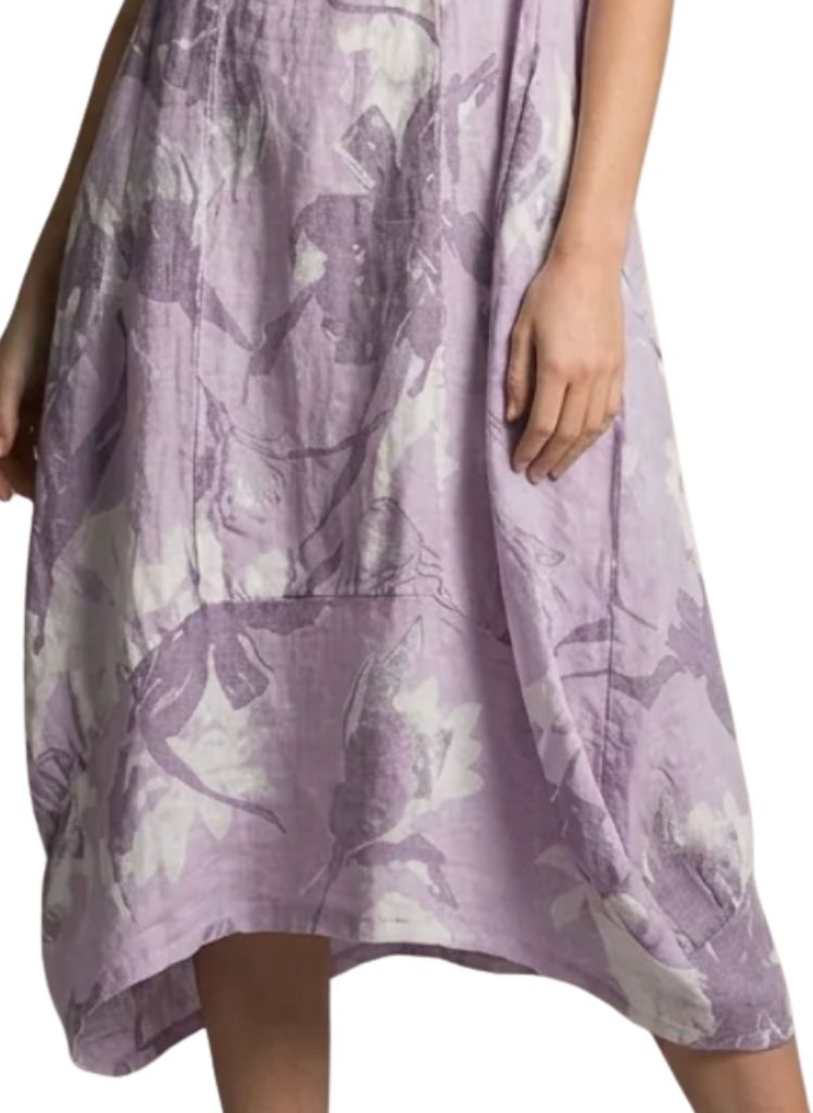 Featuring wide curved hemline, longer on the sides, and shorter in the center.  Lands between Mid-length and Maxi, depending on your height.  Model shown is 5'9" tall.