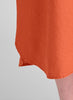 Cafe Dress, shown in Koi.  Zoomed in on the shirttail hemline, which is rounded with side slits, ending a little shorter on the either side.