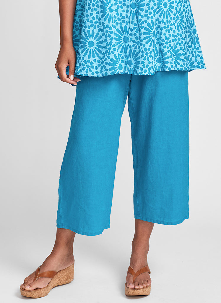 Floods, shown in Peacock (Turquoise), 100% Linen.  Model is 5'9" tall, wearing size Small.