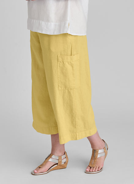 Full Time Pant, shown in Banana, size Medium.  Model is 5'9" tall.  100% Linen with Cotton Knit drawstring waistband and trim on the cargo-style pockets.