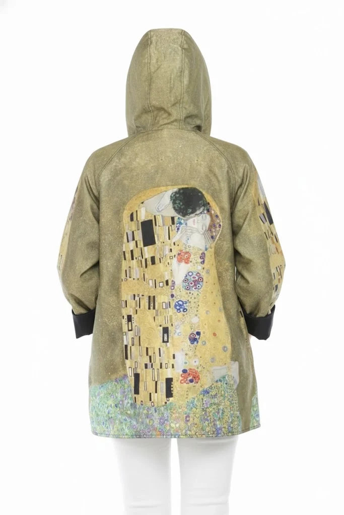 The Kiss Rain Jacket, reversible with detachable hood.  Shown on the back with the hood up, on the patterned side.