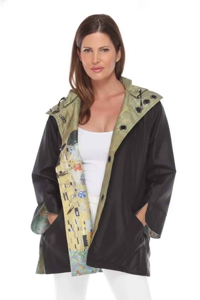 The Kiss Rain Jacket, reversible with detachable hood.  Shown open, on the sold black side.