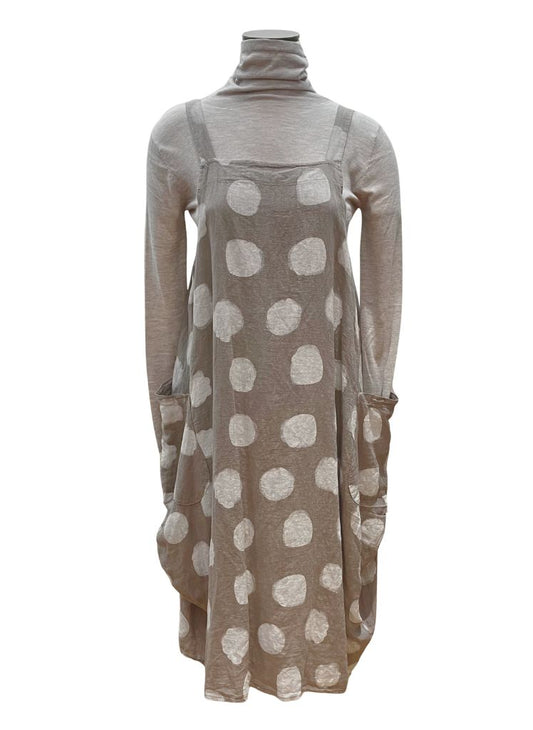 Sleeveless Dot Dress, shown in Taupe Dot) layered over a neutral turtleneck.