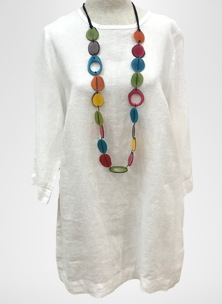 Muse Tunic, shown in White. Topped with a colorful Tagua Necklace *sold in-store only.