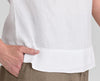 Roadie Top, shown in White.  Zoom on the wide border along the hem, with side slits.