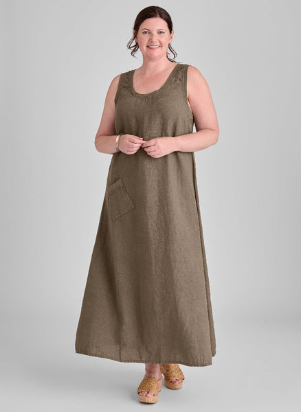 Serene Dress, shown in Java, size Medium.  Model is 5’9” tall.  100% European Linen (body) with soft Cotton Knit trim on the scoop neckline, the armholes, and along the top of the ankle front pocket.  Pre-shrunk, Machine Wash.