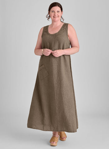 Serene Dress, shown in Java, size Medium.  Model is 5’9” tall.  100% European Linen (body) with soft Cotton Knit trim on the scoop neckline, the armholes, and along the top of the ankle front pocket.  Pre-shrunk, Machine Wash.