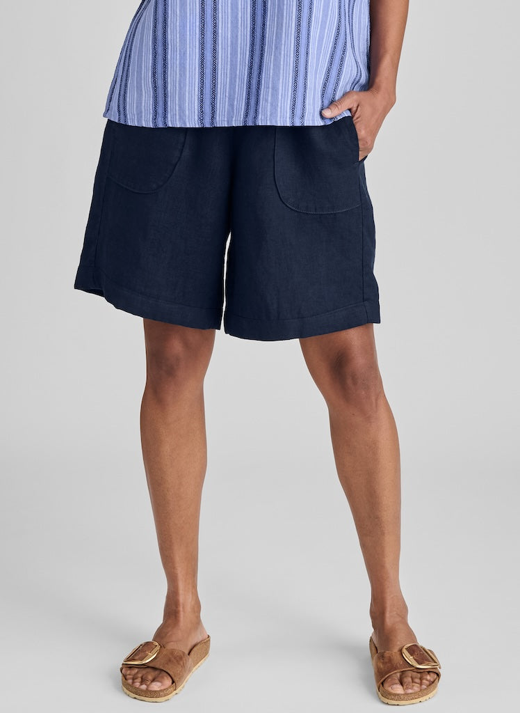 Shorty, shown in Midnight, size Small.  Model is 5'10" tall.   Note: If you are shorter than the model, these will land further down on your leg.