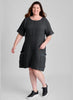 Sunny Side Dress, shown in Faded Black, size Medium. A knee length dress, with empire waist detail, and elbow length short sleeves (that can easily be rolled up). 100% Linen (Body) with Cotton Knit Trim along the round neckline and the top edge of the 2 large patch pockets. Model is 5'9" tall.