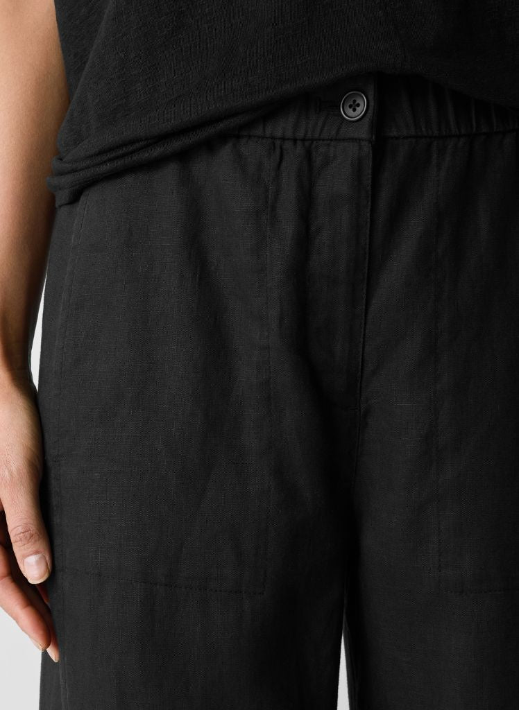 Wide Ankle Pant, shown in Black, size XS.  Featuring wide elastic waistband, button and zip fly, with 2 on-seam side pockets.  100% Organic Linen.