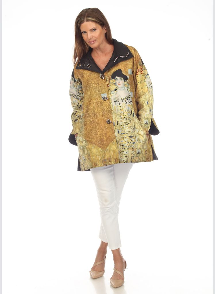 Woman in Gold Rain Coat, shown buttoned, with full length sleeves.