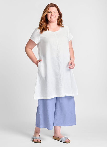 Garden Party Dress, shown in Lily (White) layered over the Sociable Floods (in Bluebell). Model is 5'9" tall, wearing size Medium. 100% Linen.