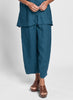 Seamly Pant (shown in Zircon), a modern and sophisticated linen pant, with a wide elastic waistband, two rounded side pockets, and unique seam detailing, full pant legs that taper along the bottom hem, landing at (or just above) the ankle, 100% Linen. Collection: FLAX Classics Two 2021.