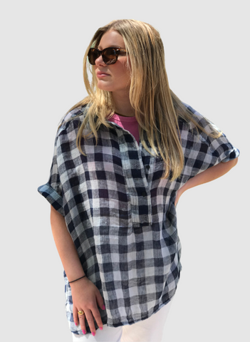 Sporty Shirt (shown in Navy Check). The model is wearing size Small, with sleeves rolled, and the front unbuttoned. 100% Linen Gauze