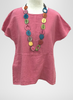 Aria Tee, shown in Bubblegum.  Paired with a colorful Tagua necklace.