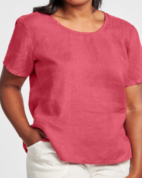 Fundamental Tee (shown in Rhubarb), a classic linen t-shirt, with a scoop neckline and short sleeves, finishing on the hip with side slits for added comfort and movement, woven in 100% Linen, with a variety of solid colors, in Regular or Plus sizes.  Collection:  FLAX Classics 2021.