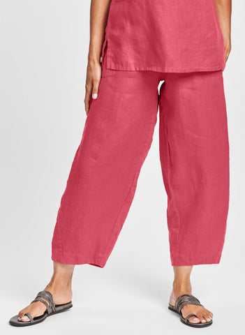 Seamly Pant (shown in Rhubarb), a modern and sophisticated linen pant, with a wide elastic waistband, two rounded side pockets, and unique seam detailing, that taper before landing at (or just above) the ankle, with a wide border, 100% Linen. Collection: FLAX Classics 2021.