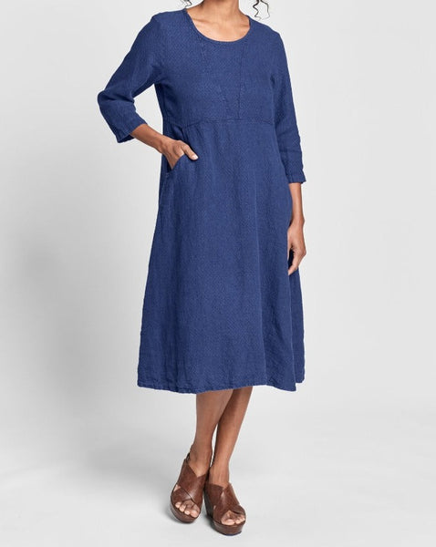 Dashing Dress (shown in Sapphire Purl), a mid-length linen dress, with 3/4 sleeves, a rounded neckline, an empire waist, and two side pockets, 100% Linen in a medium-weight, textured weave.  Collection: FLAX Classics Two 2021.