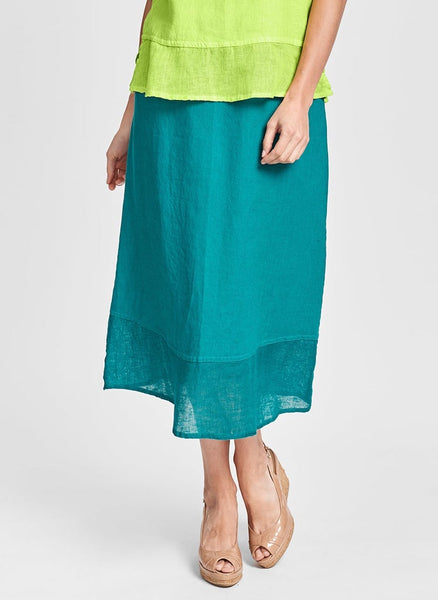 Gauzy Skirt, shown in Mediterranean (Teal).  Model is approximately 5'9" tall.  100% Linen with wide border in 100% Linen Gauze.  Available in 3 Solid Colors, in women's regular and plus sizes, FLAX Weddings 2022.