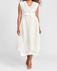 Overture (shown in Cream), a sleeveless open-front vest with solid Linen on top half, a tie closure at the waist, transitioning to Linen Gauze from the waist down - layered over the Slipster dress in Cream.  FLAX En-Core 2022.