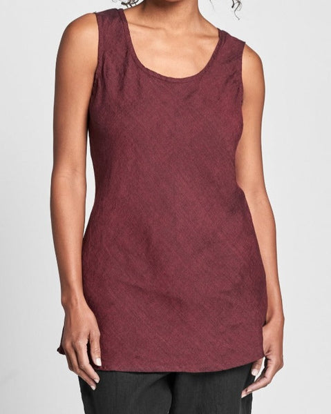 Splaying Tank (shown in Garnet Yarn Dye),  a sleeveless linen tank, with a scoop neckline, and a contoured fit throughout, as it is cut on the bias, and a flattering shape that is slightly shorter on the sides, and longer on the front and back, ending just below the hip, with a slight flair.  100% Yarn-dyed Linen, in Women's regular and plus sizes.  FLAX Fall Traveler 2021.
