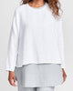 Stellar Tee, shown in White, layered over the Coastal Tunic (Mist). Model is 5'9" tall wearing size Small.