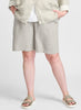 Sun Shorts, shown in Natural. 100% Linen, Model is 5'9" tall, wearing size Medium.