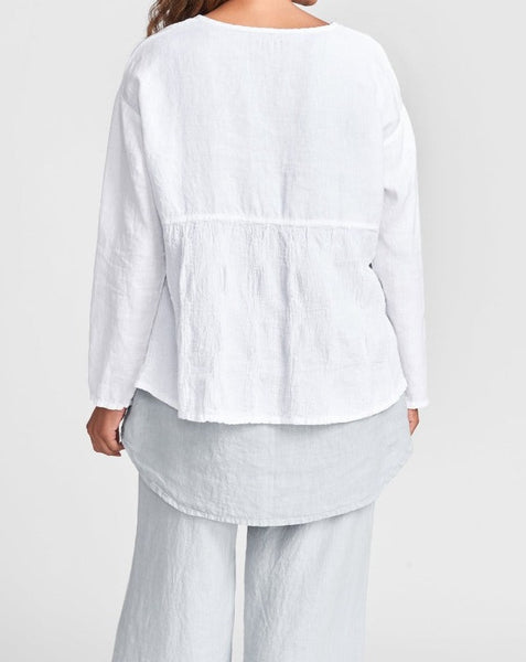 Stellar Tee, shown on the reverse in White, layered over the Coastal Tunic (Mist), paired with the  Flat Iron Pant (Mist).  Model is wearing size size Small.